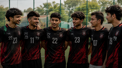 A football club in matching black TeeHub jerseys